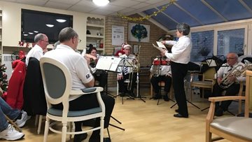 Brass band brings festive cheer to Residents at Bridgend care home